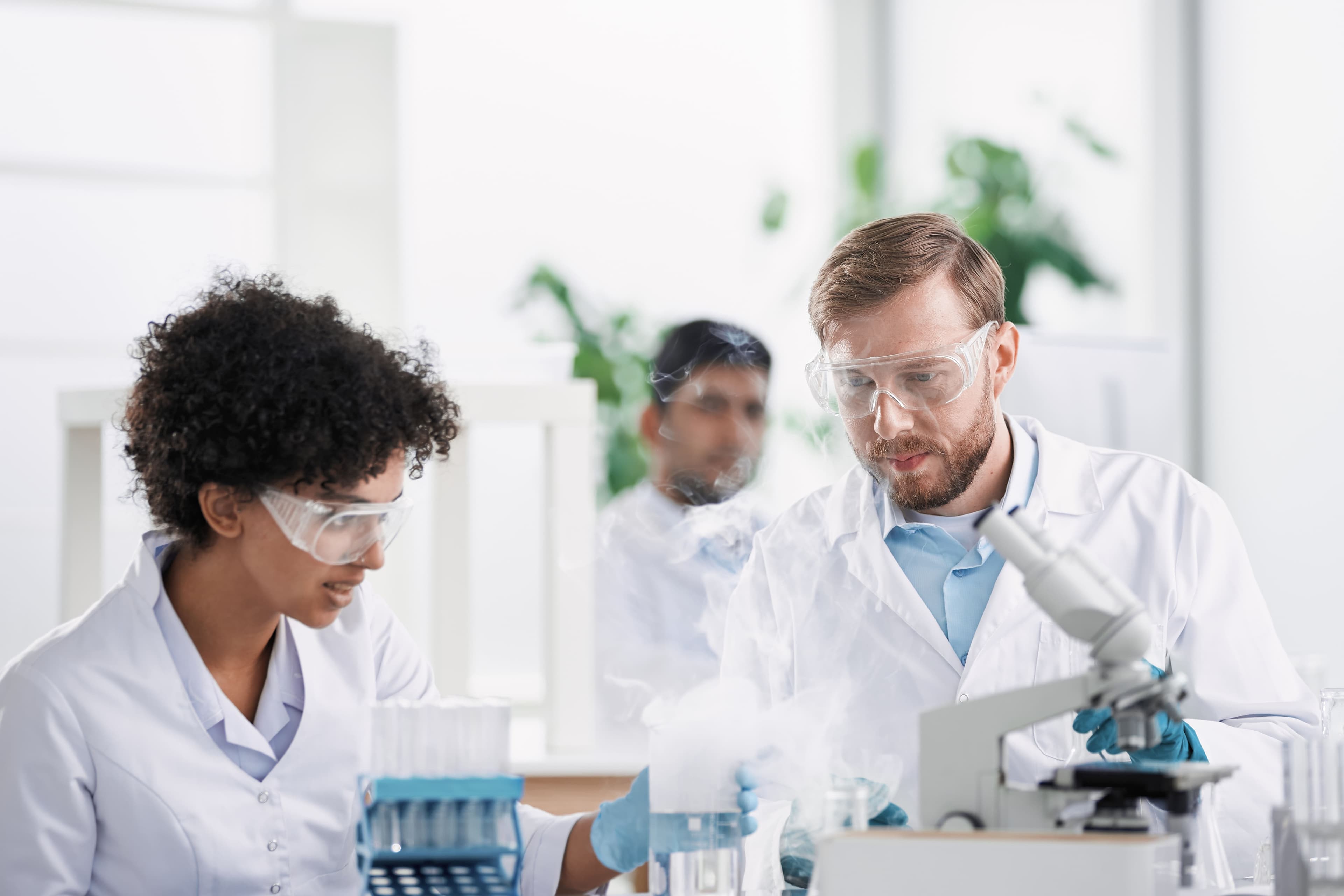 Researchers working in a continuous manufacturing laboratory